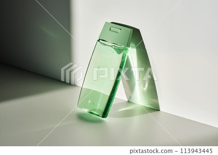 Shower gel or shampoo on a white background with sun light. 113943445