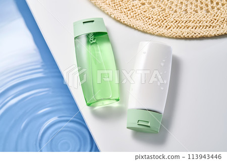 Sunscreen and gel by the water pool. 113943446