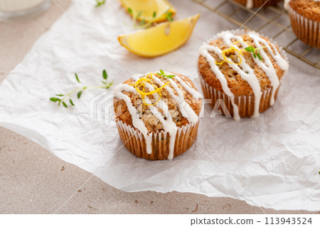 Lemon zucchini muffins with thyme and cream cheese glaze Lemon zucchini muffins with thyme and cream cheese glaze 113943524