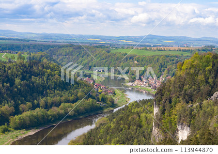 Beautiful summer view of Elbe river from Bastei view pont. Colorful morning scene of Saxon Switzerland national park, Germany, Europe. Splendid landscape of Sandstone Mountains, Saxony. 113944870