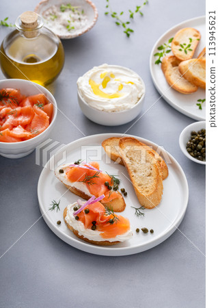 Salmon and cream cheese bruschetta with dill and capers Salmon and cream cheese bruschetta with dill and capers 113945621