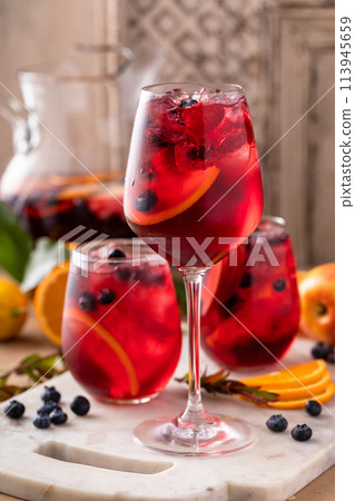 Refreshing summer berry sangria with apples, oranges and blueberry Refreshing summer berry sangria with apples, oranges and blueberry 113945659