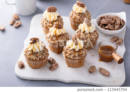 Caramel pecan cupcakes with cream cheese frosting Caramel pecan cupcakes with cream cheese frosting 113945704