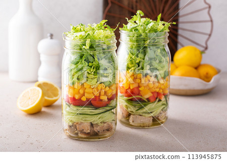 Salad meal prep in a jar, vegetables and corn salad with chicken 113945875