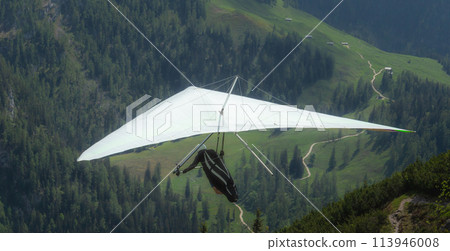 Hang gliding above mountain valley near Jenner mount Berchtesgaden National Park Hang gliding above mountain valley near Jenner mount Berchtesgaden National Park 113946008