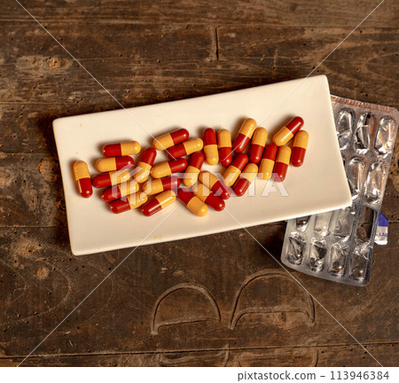 Capsules in the dish Capsules in the dish 113946384