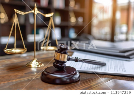 Law theme, mallet of judge, wooden gavel on table 113947239