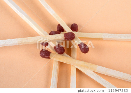 Pile of matches on a light background. Fire safety Pile of matches on a light background. Fire safety 113947283