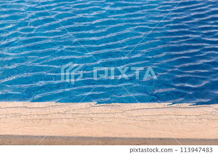 Beautiful sun reflections of water in the pool. Blue water. Background. Pure water.5 113947483
