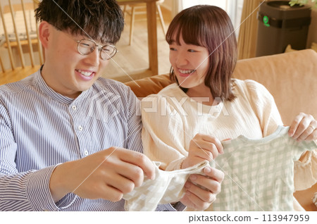 A young couple happily preparing for birth A young couple happily preparing for birth 113947959