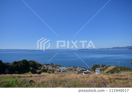 Lush bay scenery, countryside surrounded by blue sea, a spectacular spot where the mountains meet the sea Lush bay scenery, countryside surrounded by blue sea, a spectacular spot where the mountains meet the sea 113948017