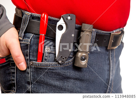 Pen, knife and flashlight with clips in your jeans pocket. EDC items 113948085