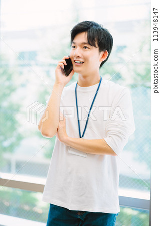 A businessman calling in the office A businessman calling in the office 113948147