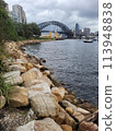 Sydney's harbour foreshore set against the famous Sydney Harbour bridge on a cloudy overcast day Sydney's harbour foreshore set against the famous Sydney Harbour bridge on a cloudy overcast day 113948838