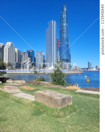 Barangaroo Reserve set against the CBD skyscrapers in Sydney, Australia on a bright sunny day 113948840