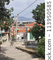 Narrow street with stone houses. Old houses and old narrow alley in Croatia. Streets in old town. 113950585