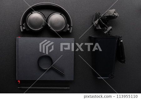 Black stationery on a black table. Black notepad and black pencil. Notes on black paper. Flat lay. Black stationery on a black table. Black notepad and black pencil. Notes on black paper. Flat lay. 113955110