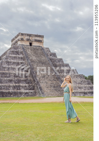 Beautiful tourist woman observing the old pyramid and temple of the castle of the Mayan architecture known as Chichen Itza these are the ruins of this ancient pre-columbian civilization and part of 113955206