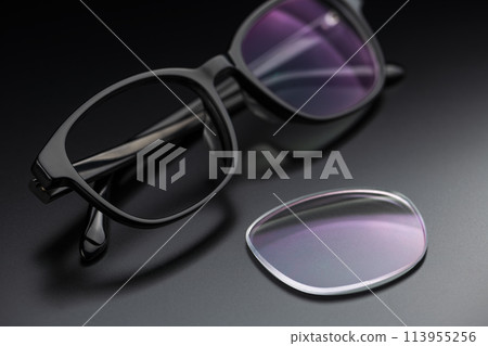 Glasses lenses on a black background Glasses lenses on a black background 113955256