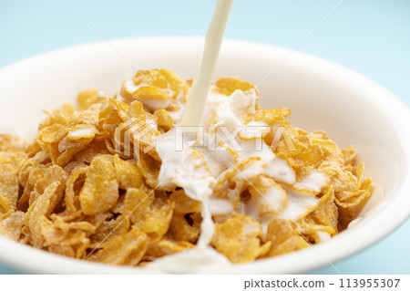 Sprinkle milk on cereal Sprinkle milk on cereal 113955307