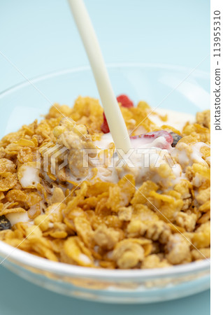 Granola with milk for breakfast 113955310