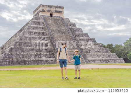 Father and son tourists observing the old pyramid and temple of the castle of the Mayan architecture known as Chichen Itza these are the ruins of this ancient pre-columbian civilization and part of 113955410