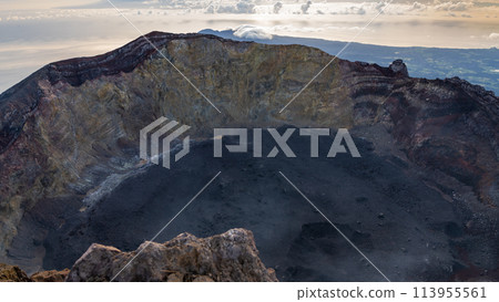 Sunrise at the top of the Ijen volcano. Panoramic view of East Java, Indonesia. The background of the natural landscape. 113955561
