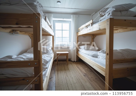 Hostel rooms with bunk wood beds. white bedding set Natural light from the window. Hostel rooms with bunk wood beds. white bedding set Natural light from the window. 113956755