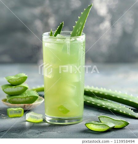Cold drinks with aloe vera ingredient top view on concrete backgrounds. Copy space Cold drinks with aloe vera ingredient top view on concrete backgrounds. Copy space 113958494