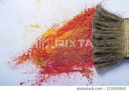 Paint brush and colorful holi powder on white background. festival concept Paint brush and colorful holi powder on white background. festival concept 113958842