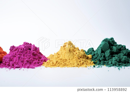 Pile of multicolored holi powder isolated on white background. Pile of multicolored holi powder isolated on white background. 113958892