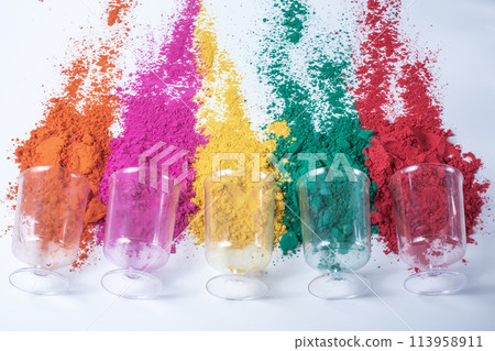 Colorful holi powder in glass isolated on white background. Colorful holi powder in glass isolated on white background. 113958911
