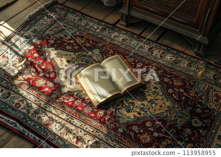 Open Koran on Muslim prayer rug 113958955