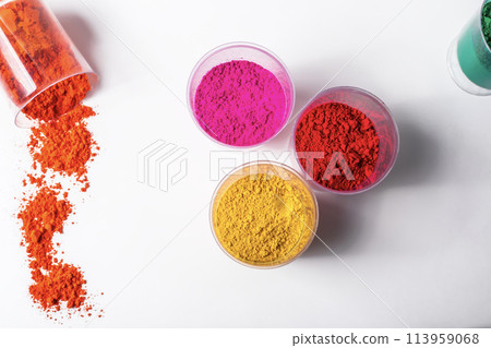 Colorful holi powder in glass jars on white background Colorful holi powder in glass jars on white background 113959068