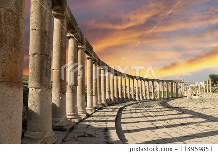 Forum (Oval Plaza) in Gerasa (Jerash), Jordan. Was built in the first century AD. Against the background of a beautiful sky with clouds. 113959851