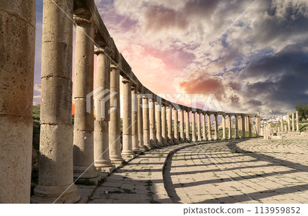 Forum (Oval Plaza) in Gerasa (Jerash), Jordan. Was built in the first century AD. Against the background of a beautiful sky with clouds. Forum (Oval Plaza) in Gerasa (Jerash), Jordan. Was built in the first century AD. Against the background of a beautiful sky with clouds. 113959852