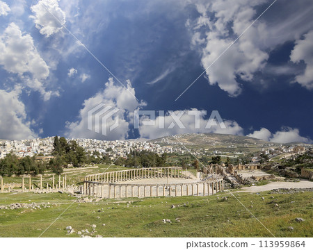 Forum (Oval Plaza) in Gerasa (Jerash), Jordan. Was built in the first century AD. Against the background of a beautiful sky with clouds. Forum (Oval Plaza) in Gerasa (Jerash), Jordan. Was built in the first century AD. Against the background of a beautiful sky with clouds. 113959864