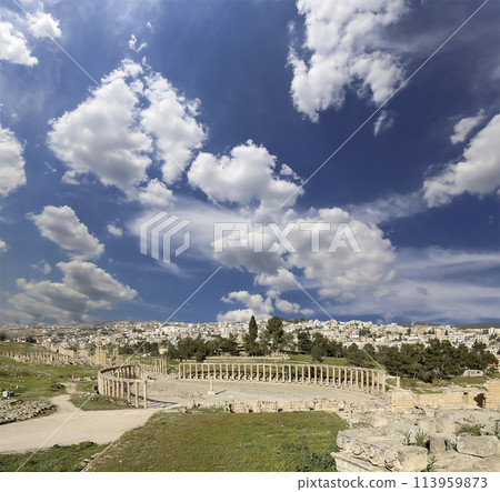Forum (Oval Plaza) in Gerasa (Jerash), Jordan. Was built in the first century AD. Against the background of a beautiful sky with clouds. 113959873