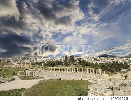 Forum (Oval Plaza) in Gerasa (Jerash), Jordan. Was built in the first century AD. Against the background of a beautiful sky with clouds. Forum (Oval Plaza) in Gerasa (Jerash), Jordan. Was built in the first century AD. Against the background of a beautiful sky with clouds. 113959876