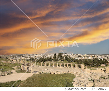 Forum (Oval Plaza) in Gerasa (Jerash), Jordan. Was built in the first century AD. Against the background of a beautiful sky with clouds. 113959877
