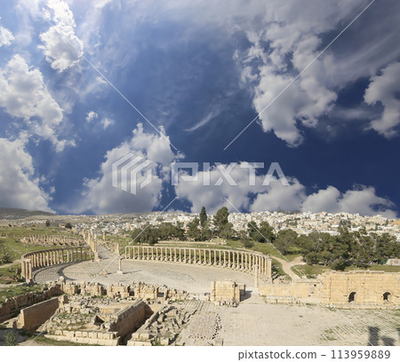 Forum (Oval Plaza) in Gerasa (Jerash), Jordan. Was built in the first century AD. Against the background of a beautiful sky with clouds. 113959889