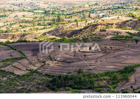 Beautiful mountain landscape with traditional Ethiopian houses, Amhara Region Ethiopia, Africa. Beautiful mountain landscape with traditional Ethiopian houses, Amhara Region Ethiopia, Africa. 113960044