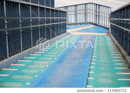 Stairs of a pedestrian overpass 113960722