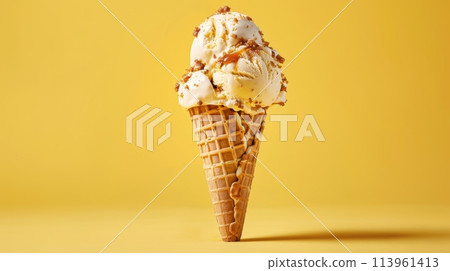 Caramel Ice Cream in Waffle Cone on Yellow Background 113961413
