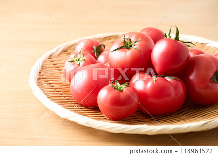 Tomatoes in a colander 113961572