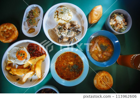 Table full of delicious traditional russian food with beer and bread 113962606