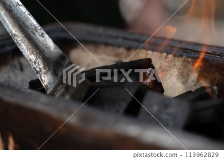 Burning charcoal 113962829