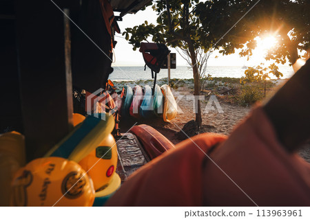Kayaks stacked at a rental shop by the sea Kayaks stacked at a rental shop by the sea 113963961