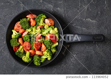 fried juicy sausage and crispy broccoli in skillet fried juicy sausage and crispy broccoli in skillet 113964052