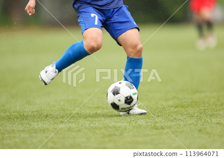 Player dribbling a soccer ball Player dribbling a soccer ball 113964071